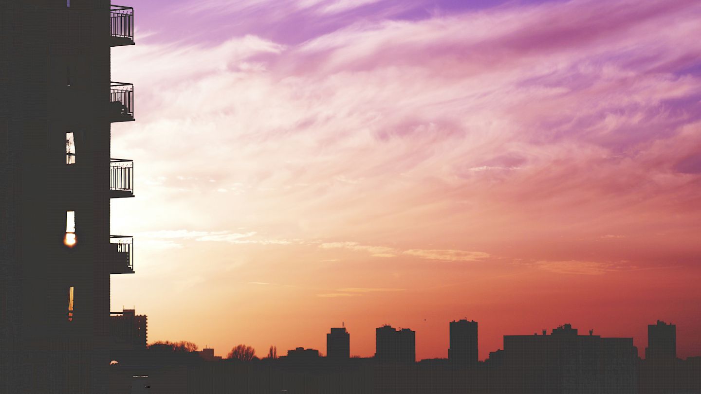 Sunrise over city buildings